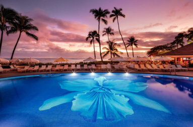 Halekulani Pool view at Sunset overlooking Waikiki Beach