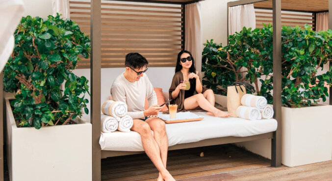 Couple enjoying the gazebo at the pool deck of Halepuna